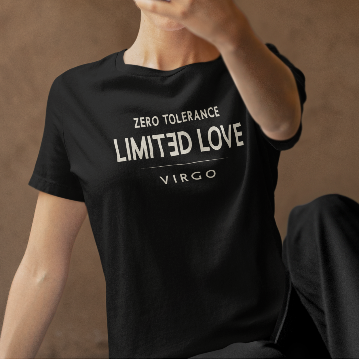 Model wearing Virgo zodiac t-shirt with “Zero Tolerance Limited Love” typography quote design