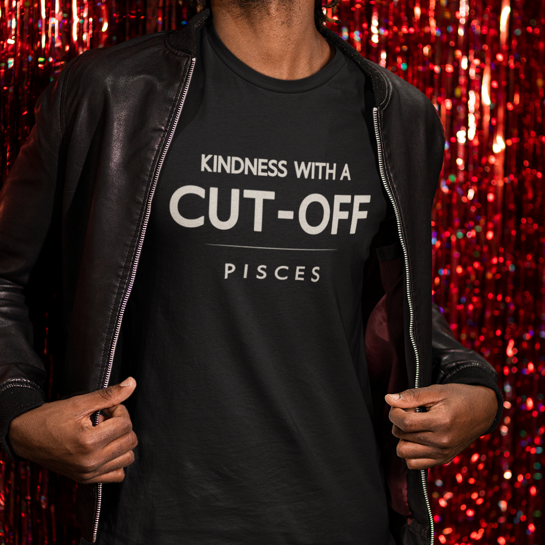 Model wearing Pisces zodiac t-shirt with “Kindness with a Cut-Off” typography quote