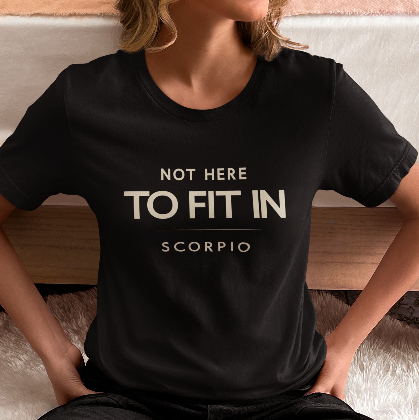 Model wearing Scorpio zodiac t-shirt with “Not Here to Fit In” quote design