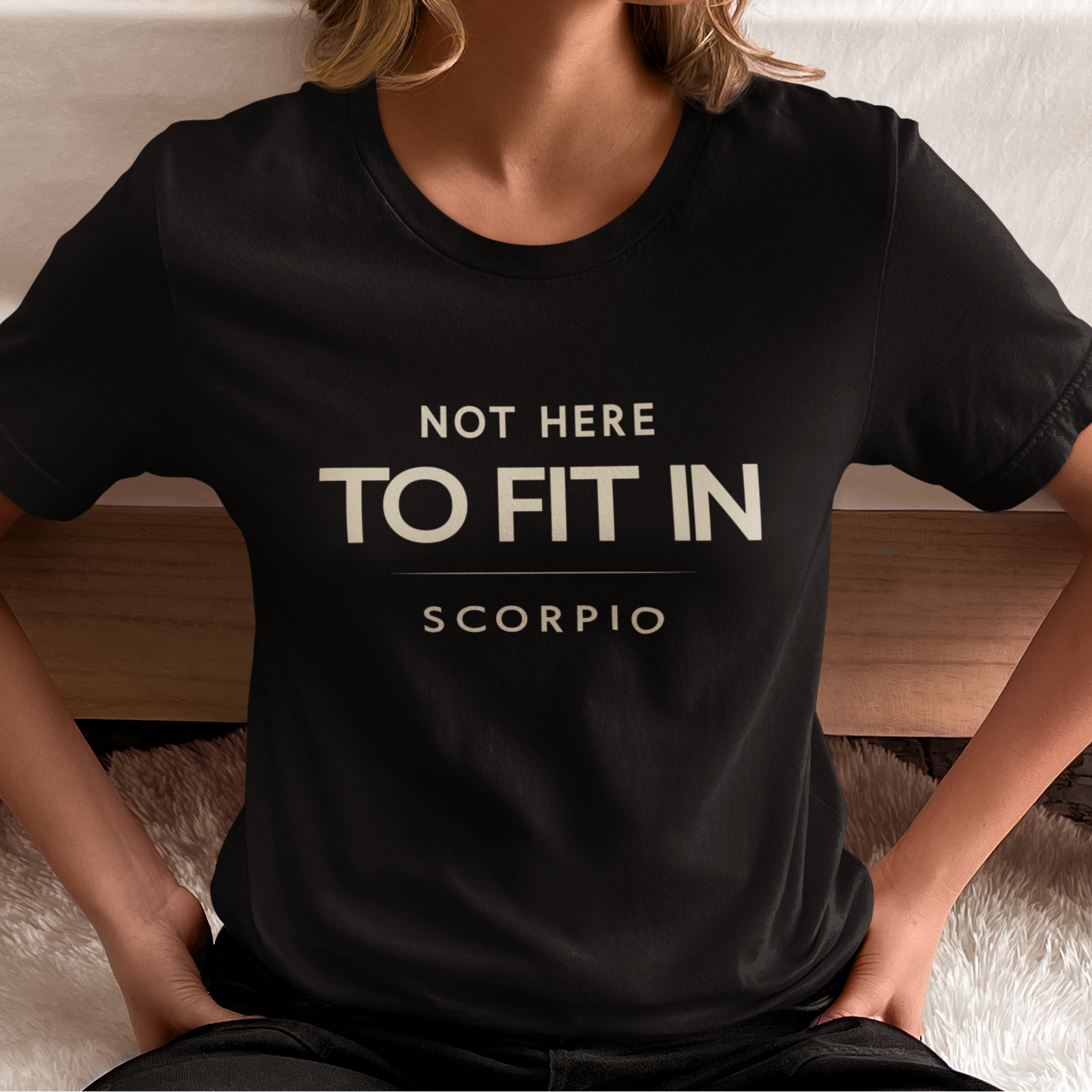 Model wearing Scorpio zodiac t-shirt with “Not Here to Fit In” quote design