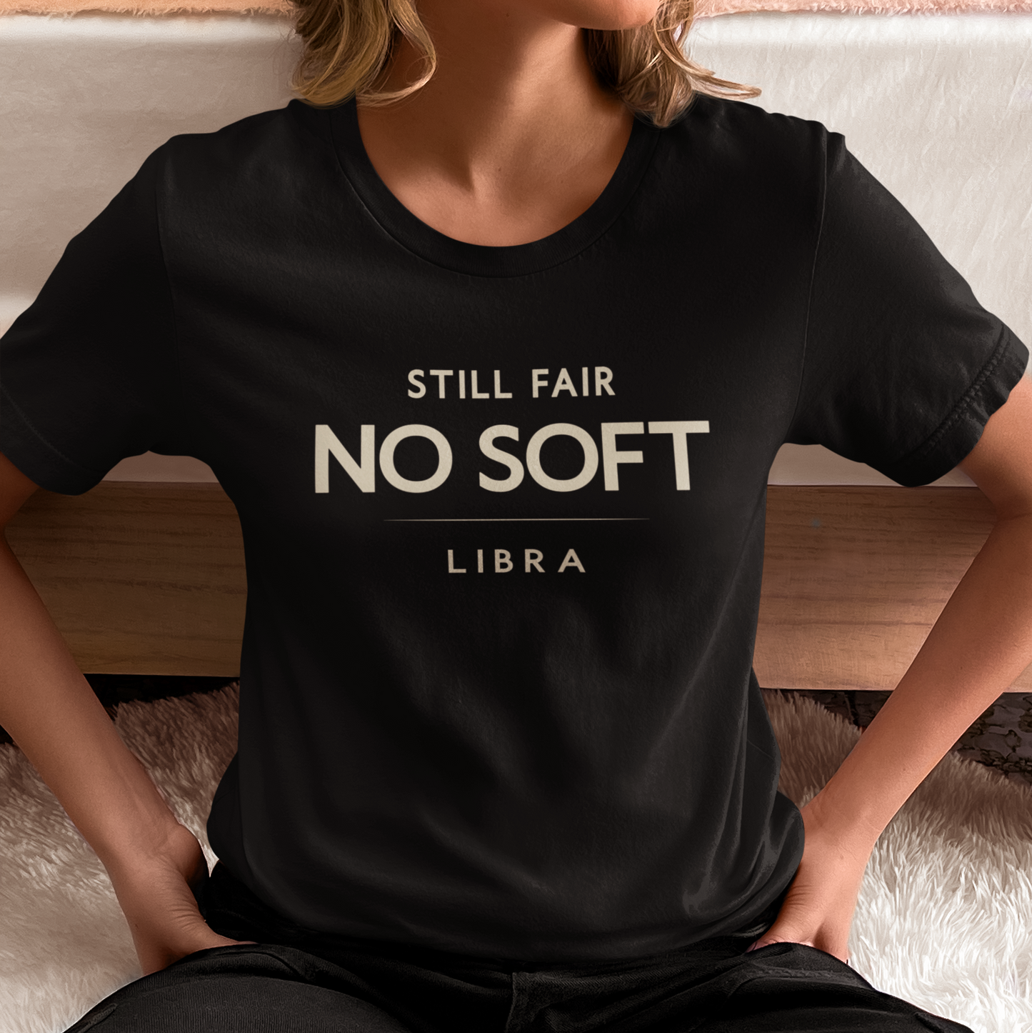 Model wearing Libra zodiac t-shirt with bold “Still Fair No Soft” typography quote