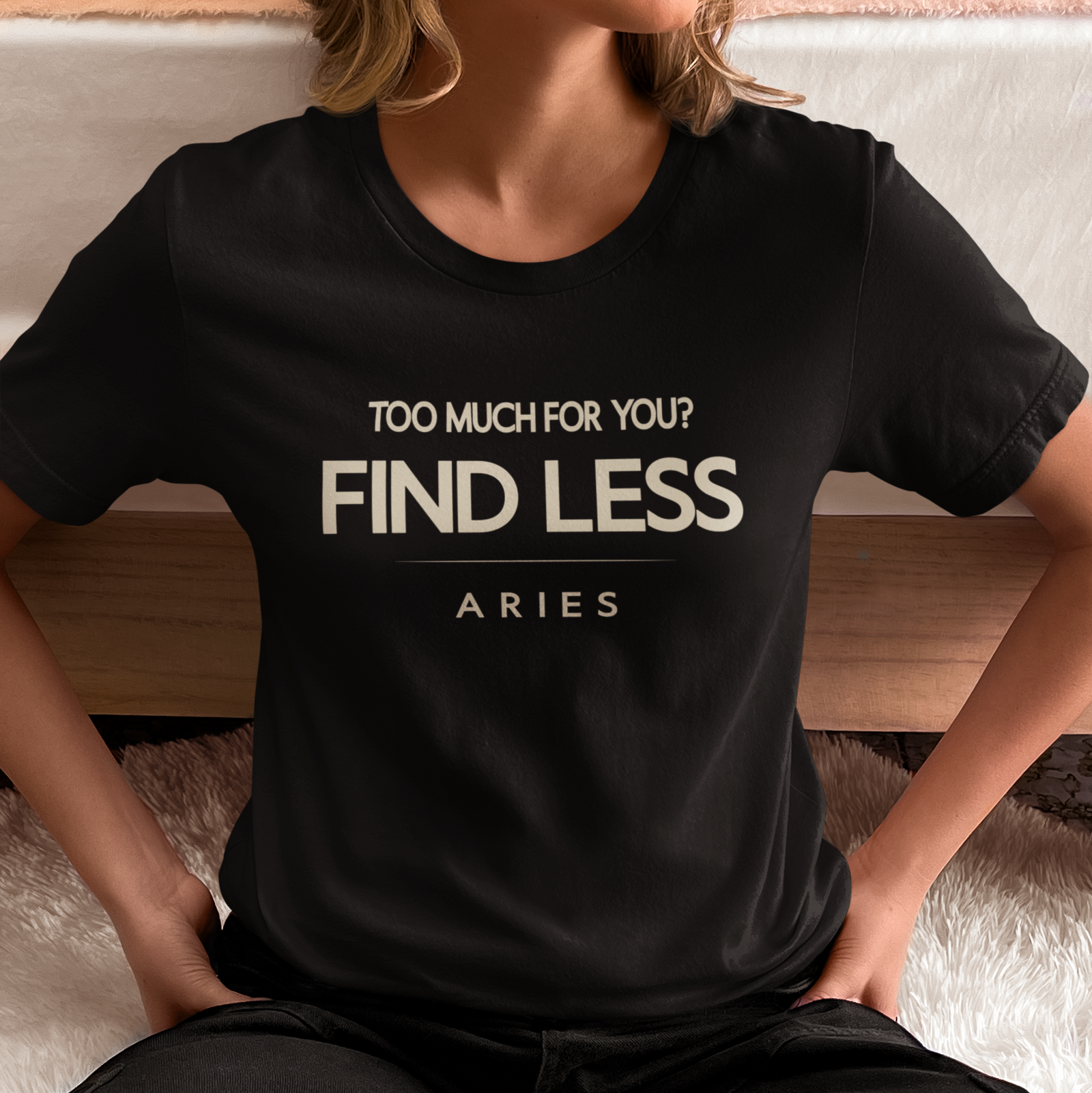 Model wearing Aries zodiac t-shirt with “Too Much for You? Find Less” typography quote design