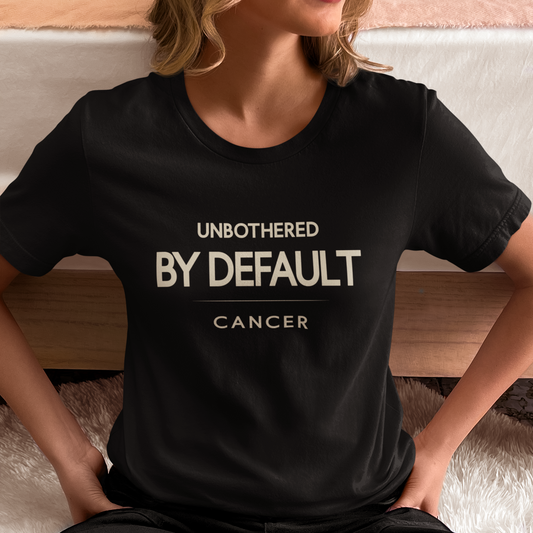 Model wearing Cancer zodiac t-shirt with “Unbothered by Default” typography quote design