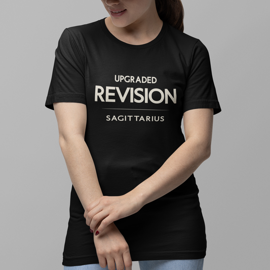 Model wearing Sagittarius zodiac t-shirt with “Upgraded Revision” typography quote design