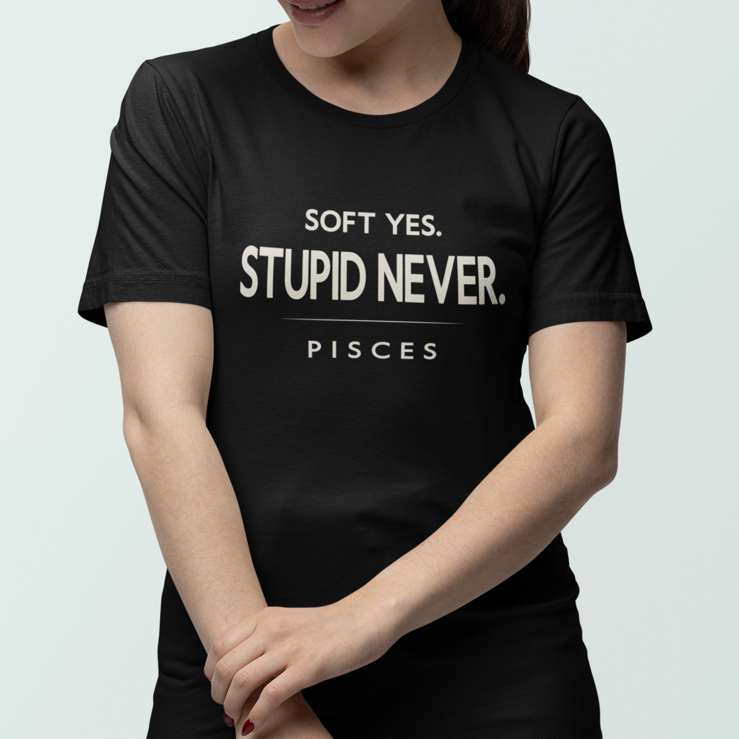Model wearing Pisces zodiac t-shirt with “Soft Yes Stupid Never” typography quote