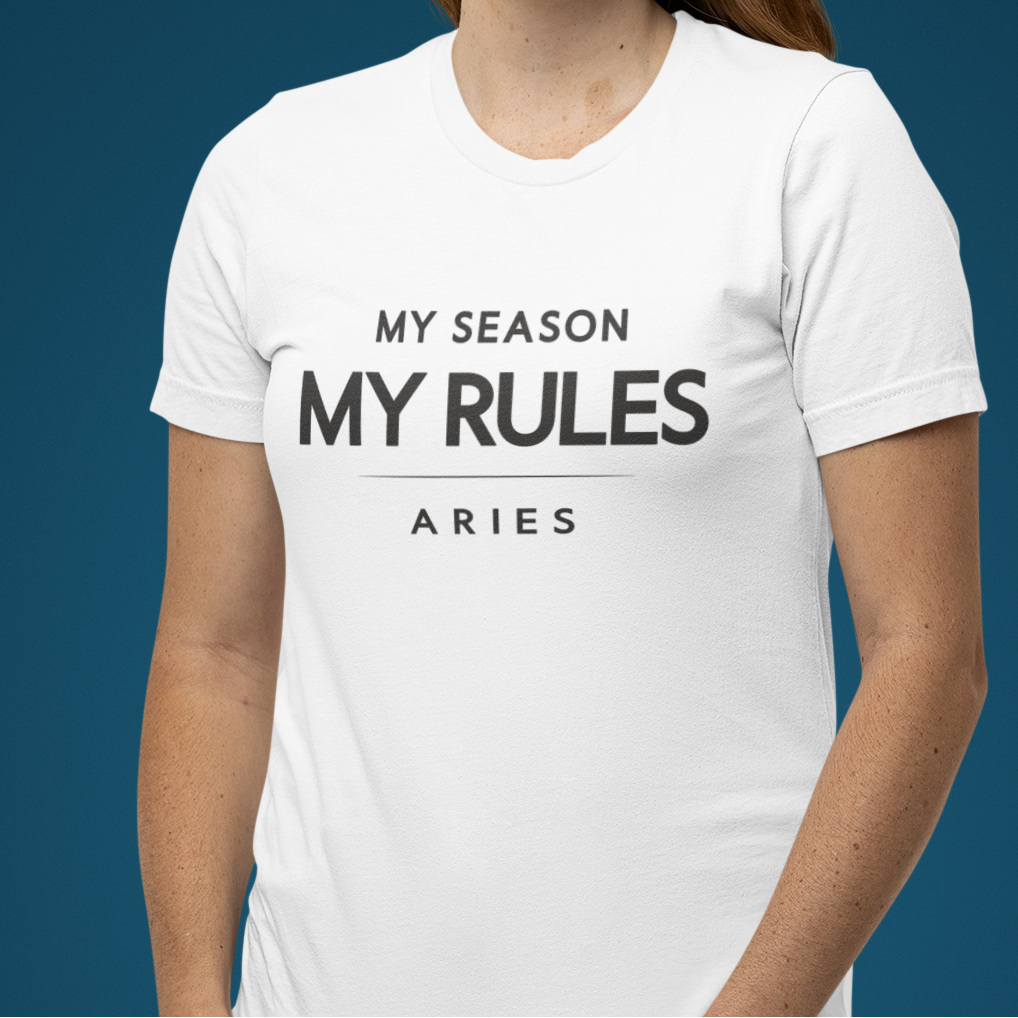 Model wearing white Aries zodiac t-shirt with “My season my rules” bold typography quote