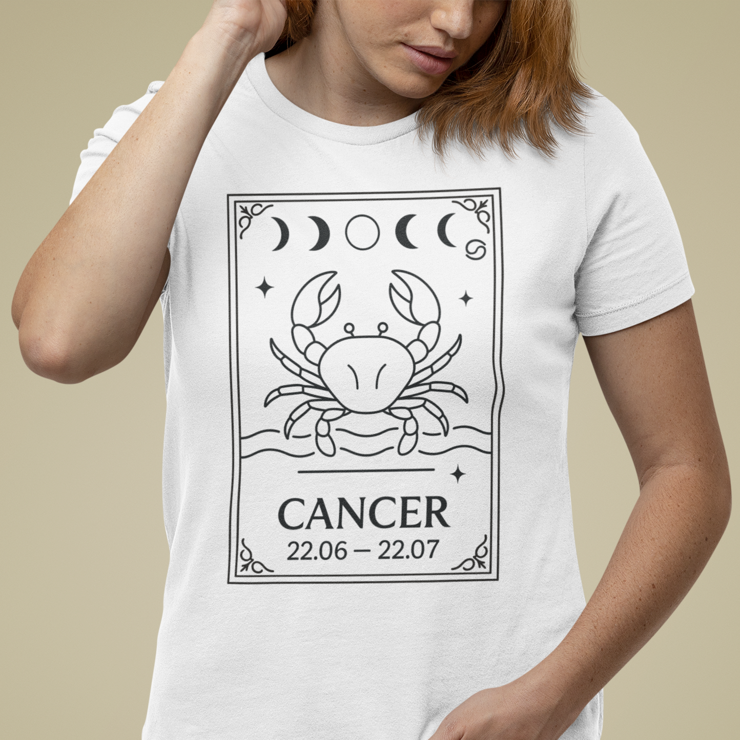 Model wearing Cancer zodiac t-shirt with minimalist crab card and moon phase design.