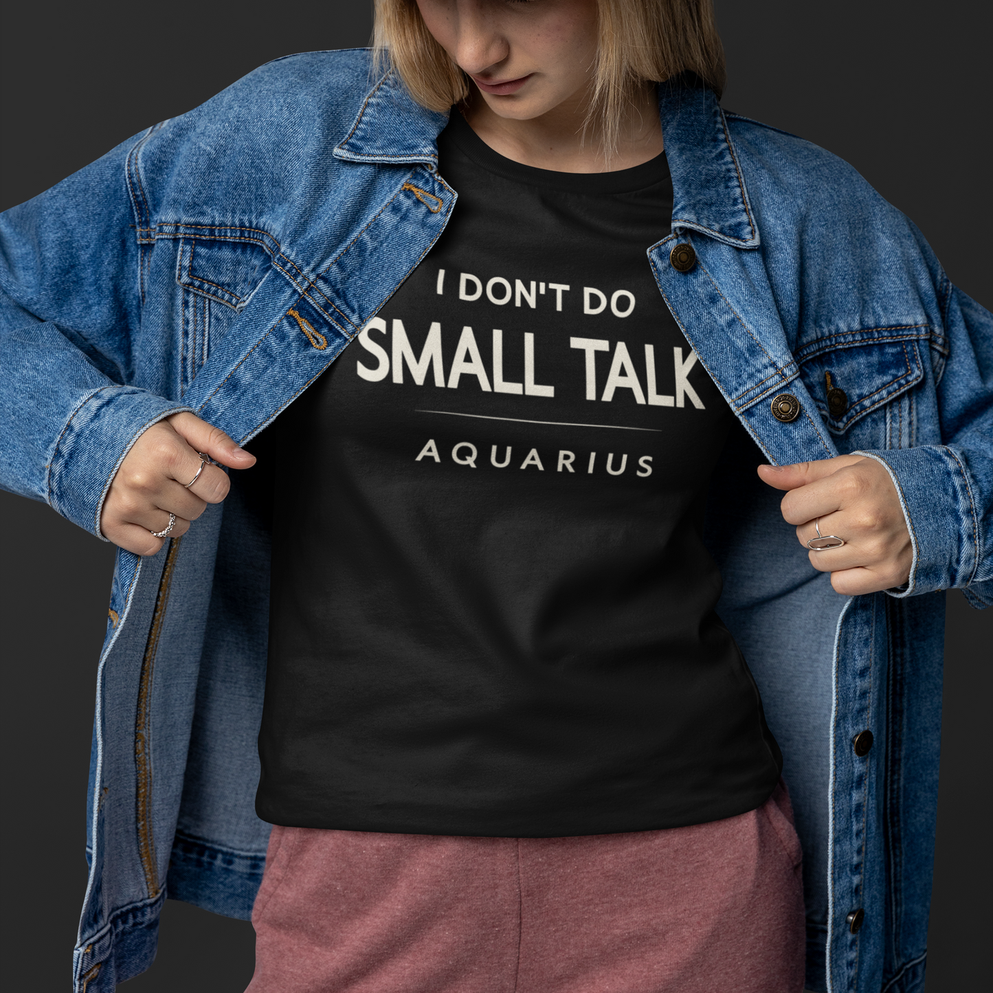Model wearing Aquarius zodiac T-shirt with I don’t do small talk text design.