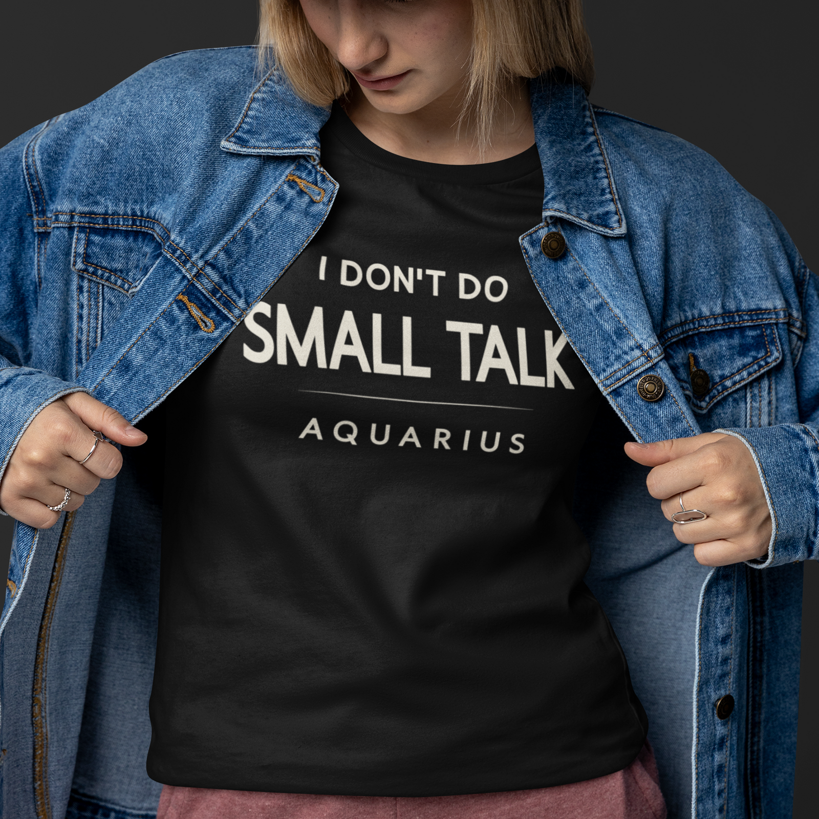 Model wearing Aquarius zodiac T-shirt with I don’t do small talk text design.