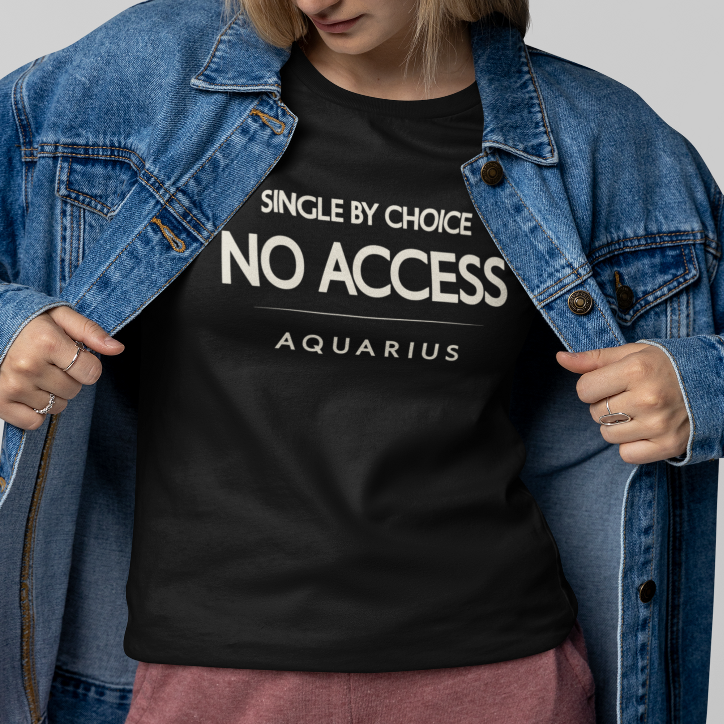 Model wearing Aquarius zodiac t-shirt with “Single by Choice No Access” typography quote