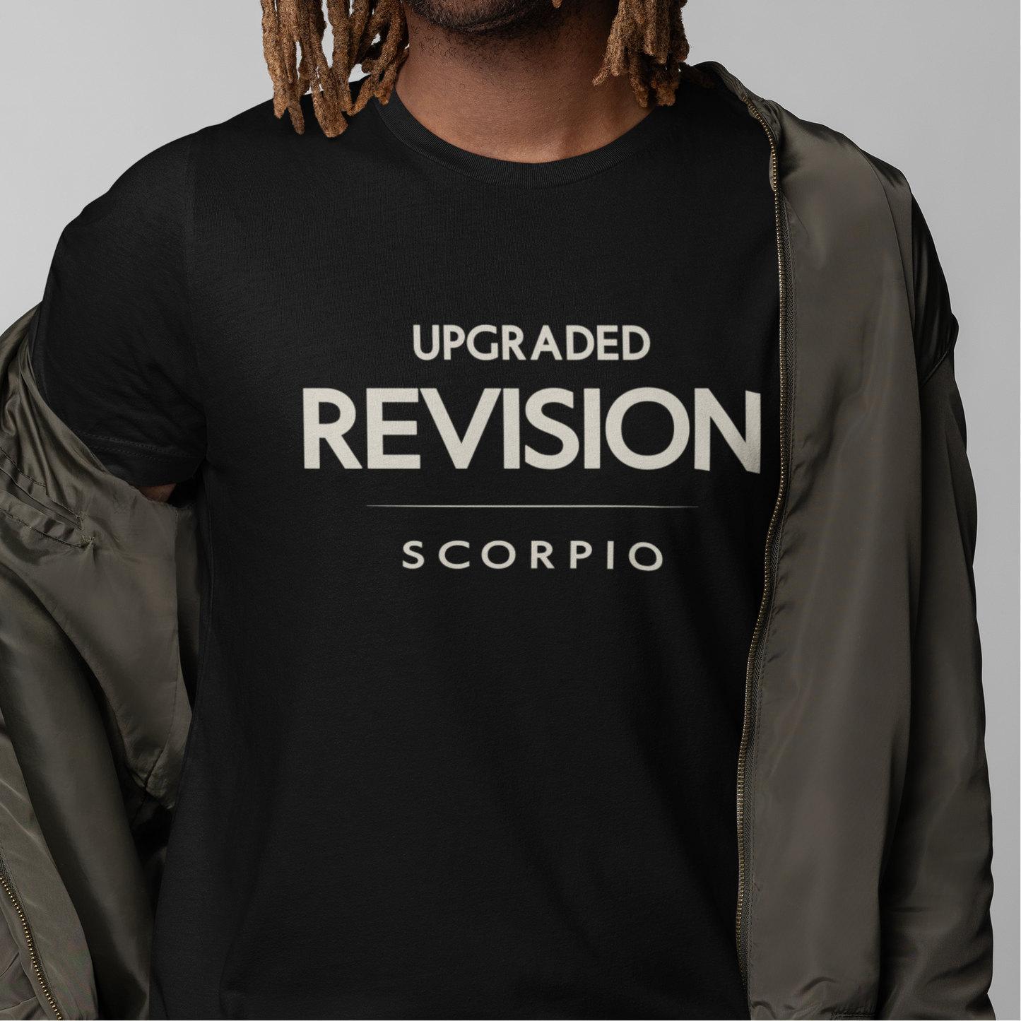 Model wearing Scorpio zodiac t-shirt with “Upgraded Revision” typography quote design