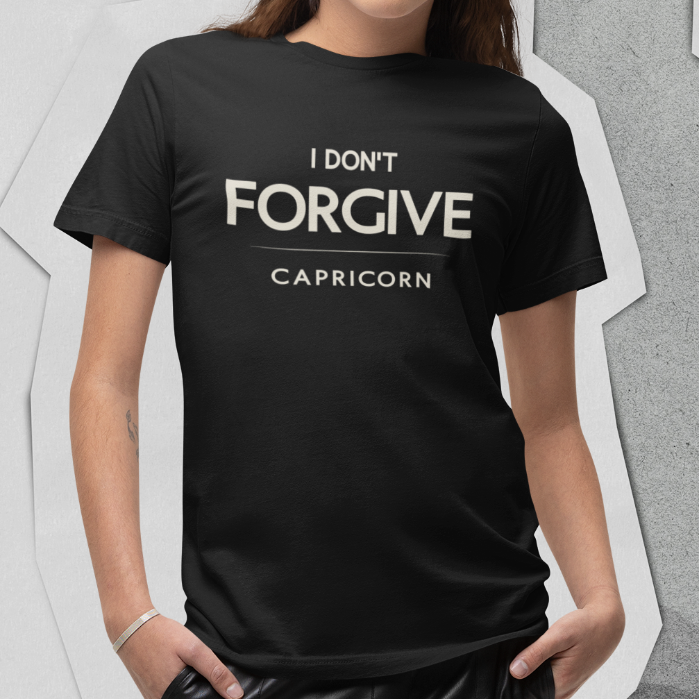 Model wearing Capricorn zodiac t-shirt with “I Don’t Forgive” typography quote design