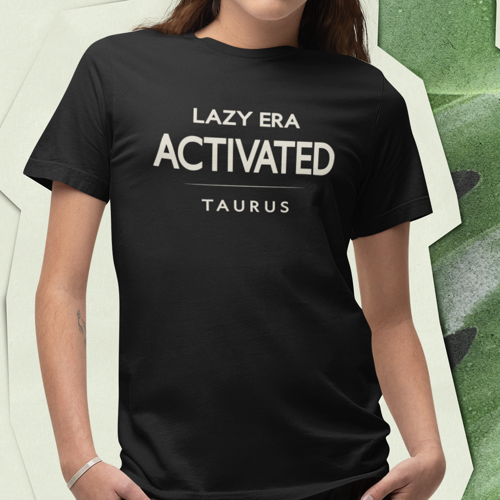 Model wearing Taurus zodiac t-shirt with “Lazy Era Activated” typography quote design
