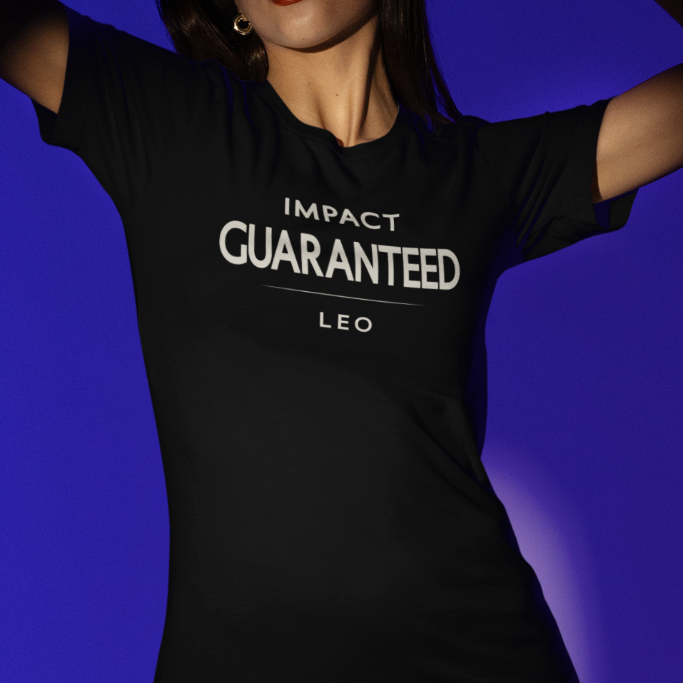 Model wearing Leo zodiac t-shirt with bold “Impact Guaranteed” typography quote
