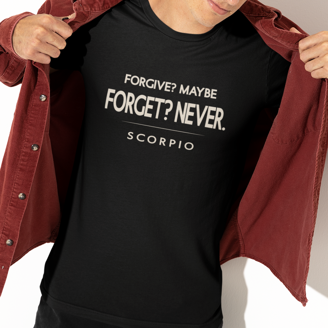 Model wearing Scorpio zodiac t-shirt with “Forgive? Maybe. Forget? Never.” quote