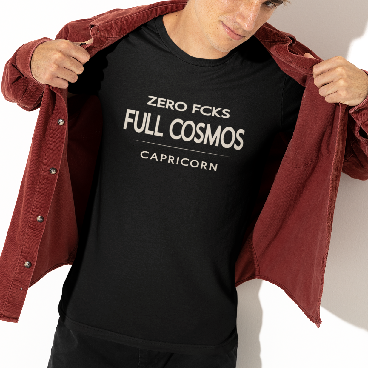 Model wearing Capricorn zodiac t-shirt with “Zero FCKS Full Cosmos” typography quote