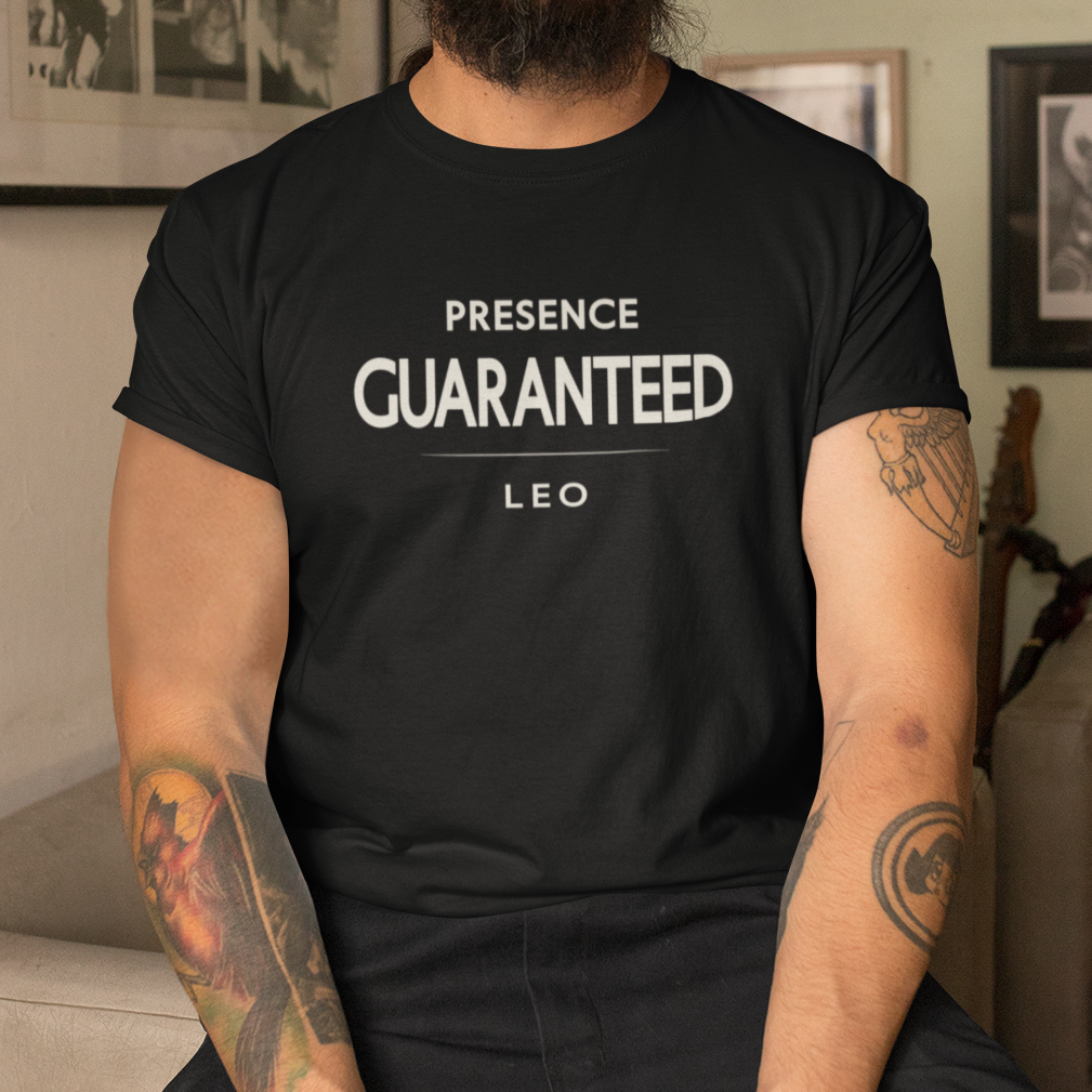 Model wearing Leo zodiac t-shirt with bold “Presence Guaranteed” typography quote