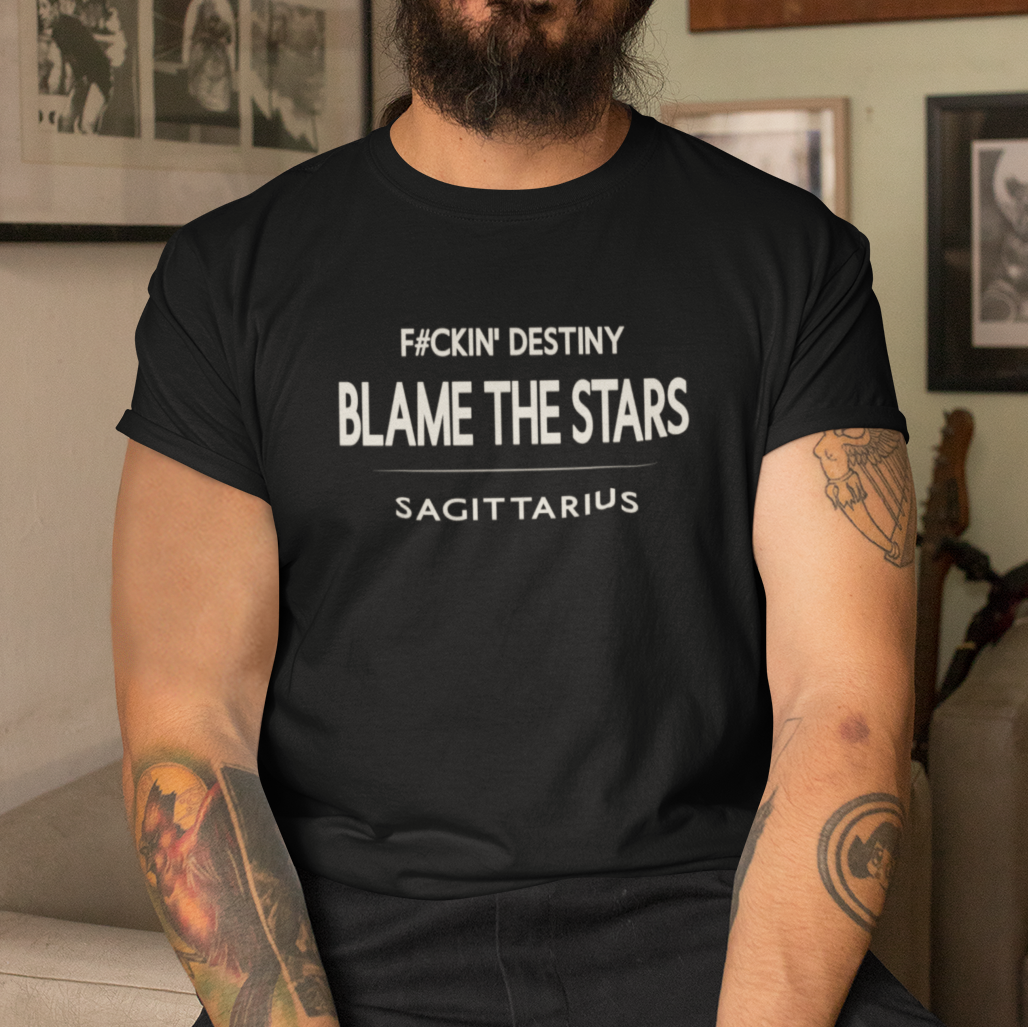 Model wearing Sagittarius zodiac t-shirt with “F#ckin' Destiny Blame the Stars” typography quote