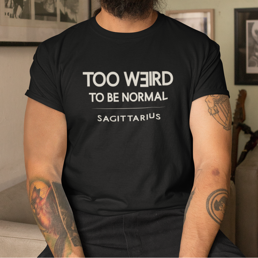 Model wearing Sagittarius zodiac t-shirt with “Too Weird to Be Normal” typography quote design
