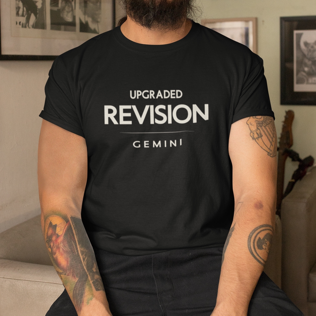 Model wearing Gemini zodiac t-shirt with “Upgraded Revision” typography quote design
