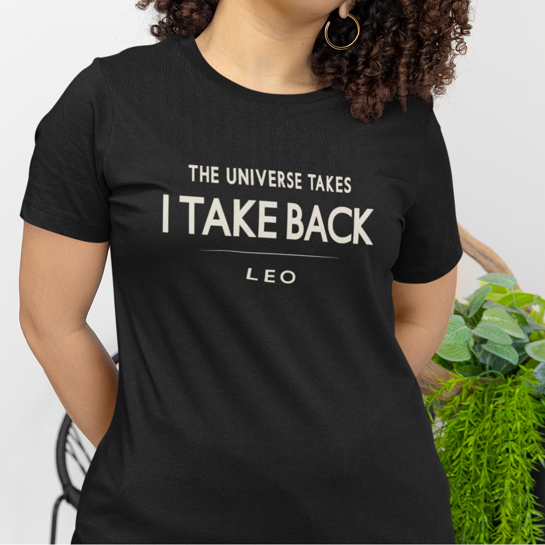 Model wearing Leo zodiac t-shirt with “The Universe Takes I Take Back” bold typography quote