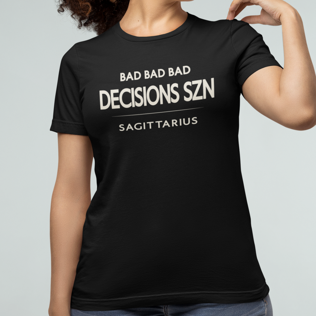 Model wearing Sagittarius zodiac t-shirt with “Bad Bad Bad Decisions SZN” typography quote design