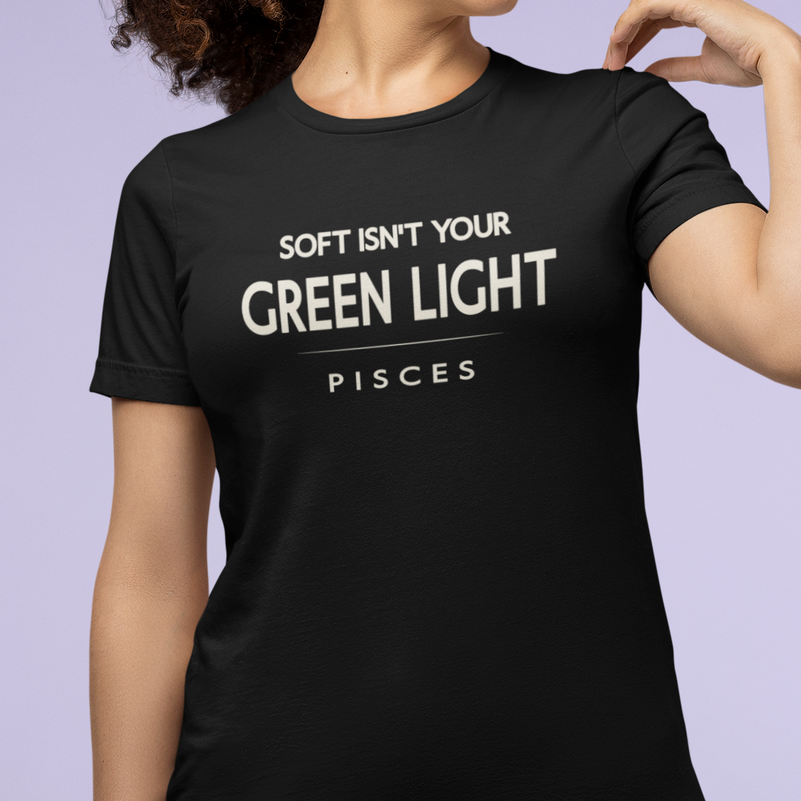 Model wearing Pisces zodiac t-shirt with “Soft Isn’t Your Green Light” typography quote