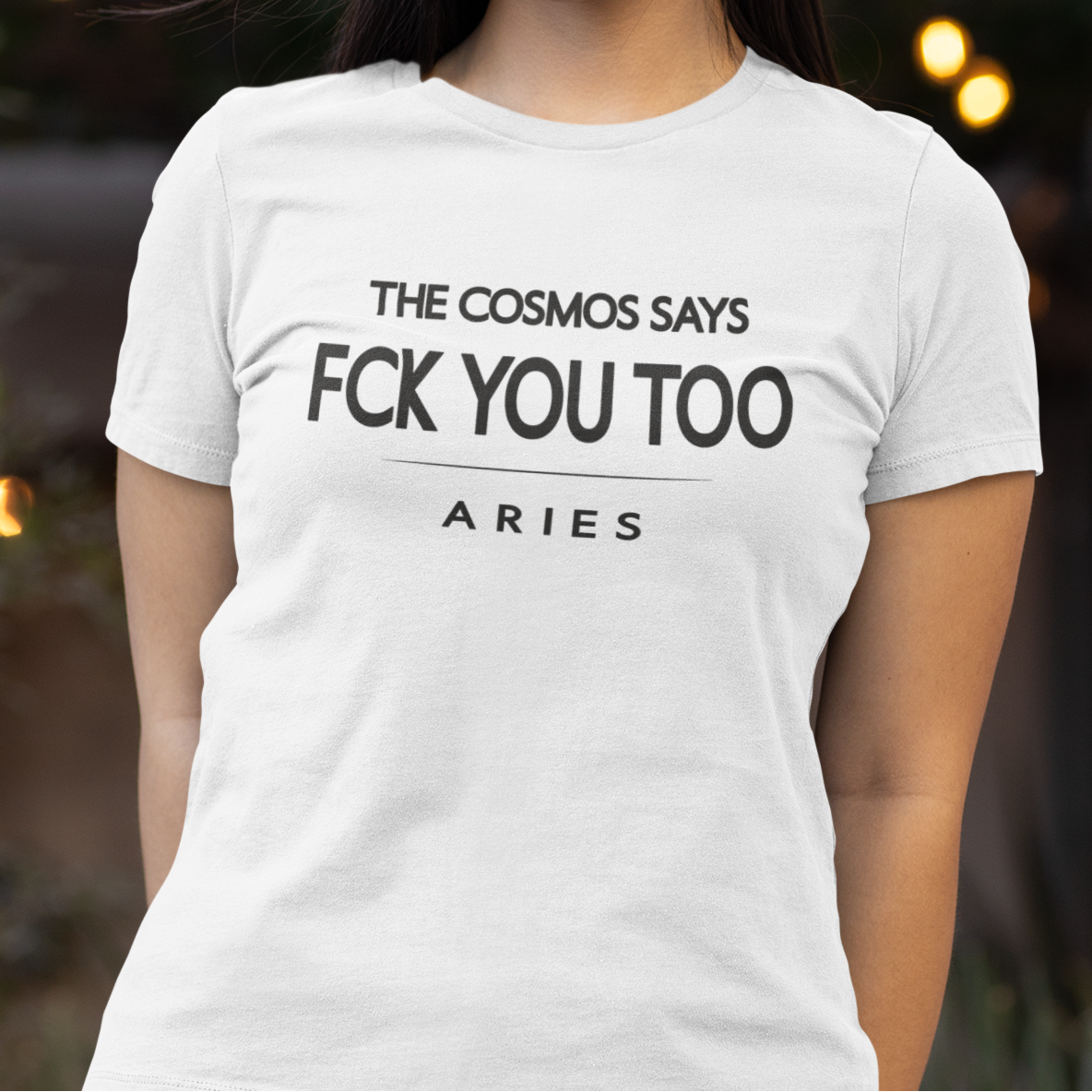 Model wearing Aries zodiac t-shirt with bold typography quote “The cosmos says FCK you too”.