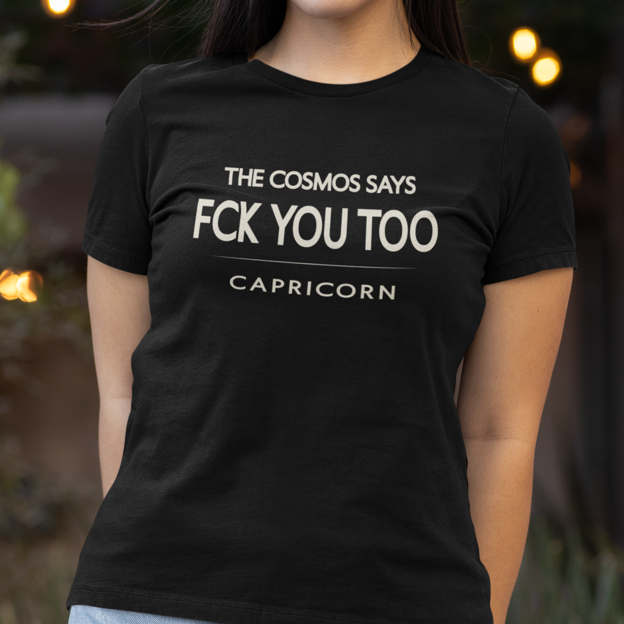 Model wearing Capricorn zodiac t-shirt with “The Cosmos Says FCK You Too” typography quote