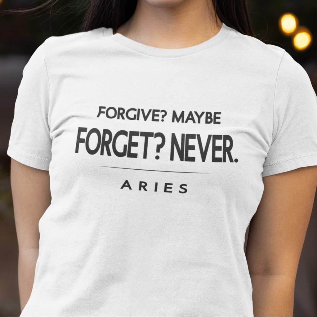 Model wearing Aries zodiac t-shirt with Forgive Maybe Forget Never typography.
