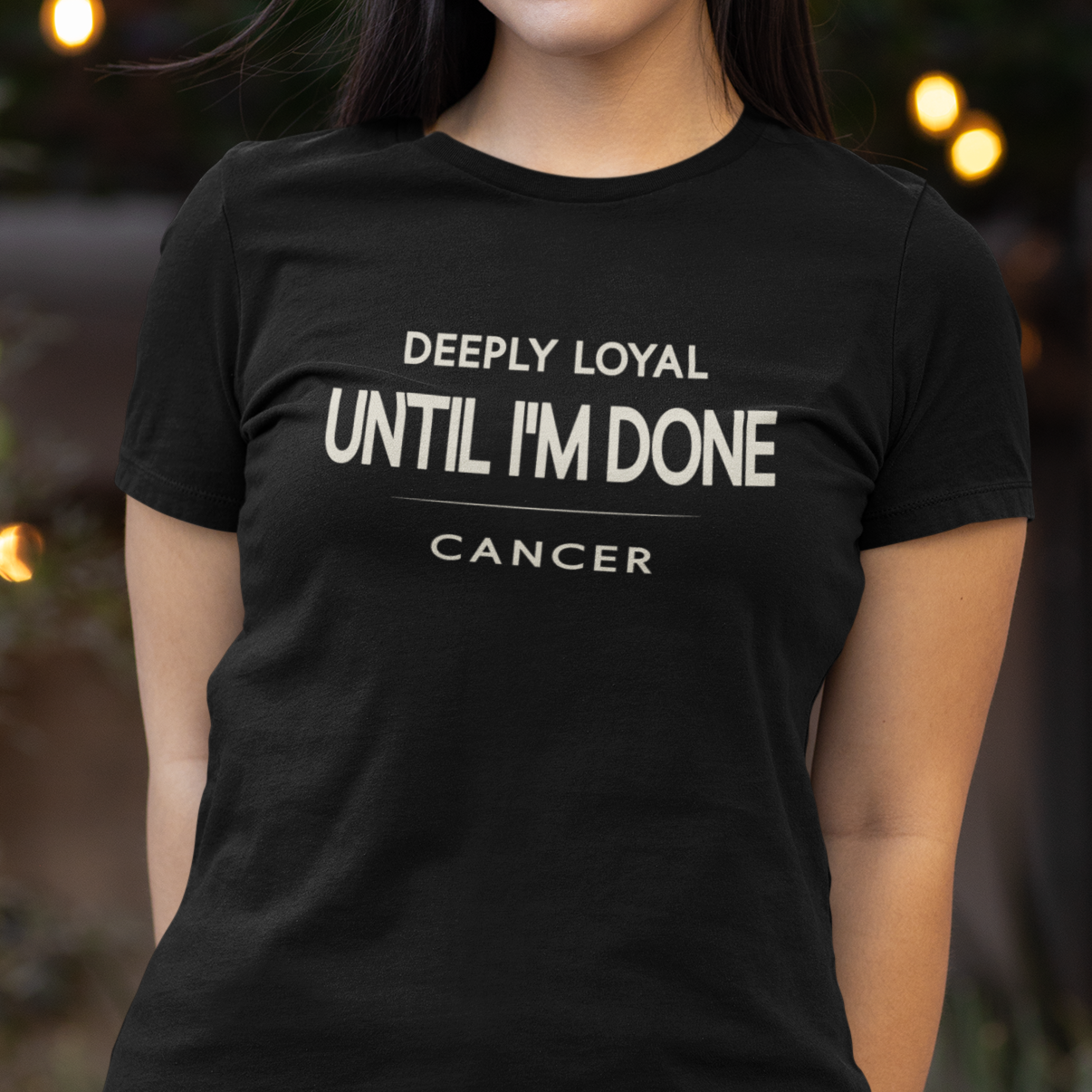 Model wearing Cancer zodiac t-shirt with “Deeply Loyal Until I’m Done” typography quote