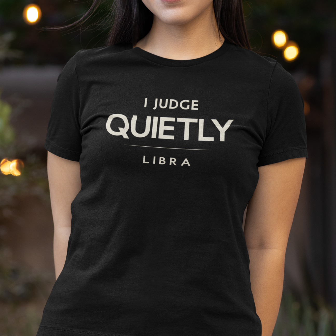 Model wearing Libra zodiac t-shirt with “I Judge Quietly” typography quote