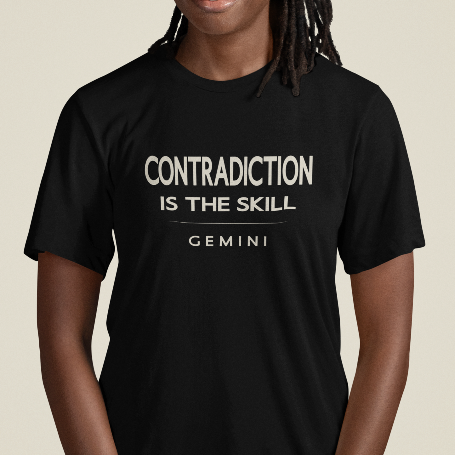 Model wearing Gemini zodiac t-shirt with “Contradiction Is the Skill” typography quote