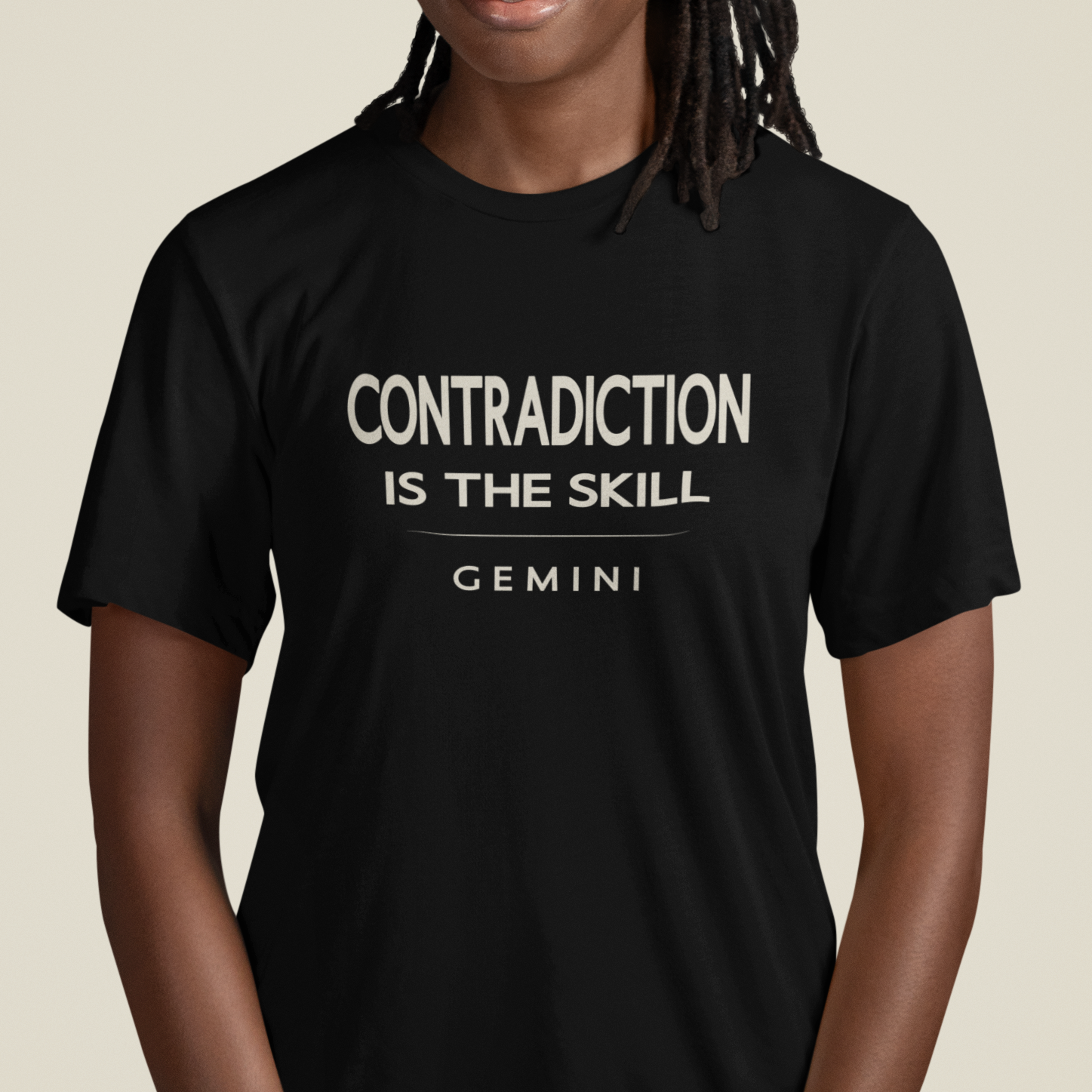 Model wearing Gemini zodiac t-shirt with “Contradiction Is the Skill” typography quote