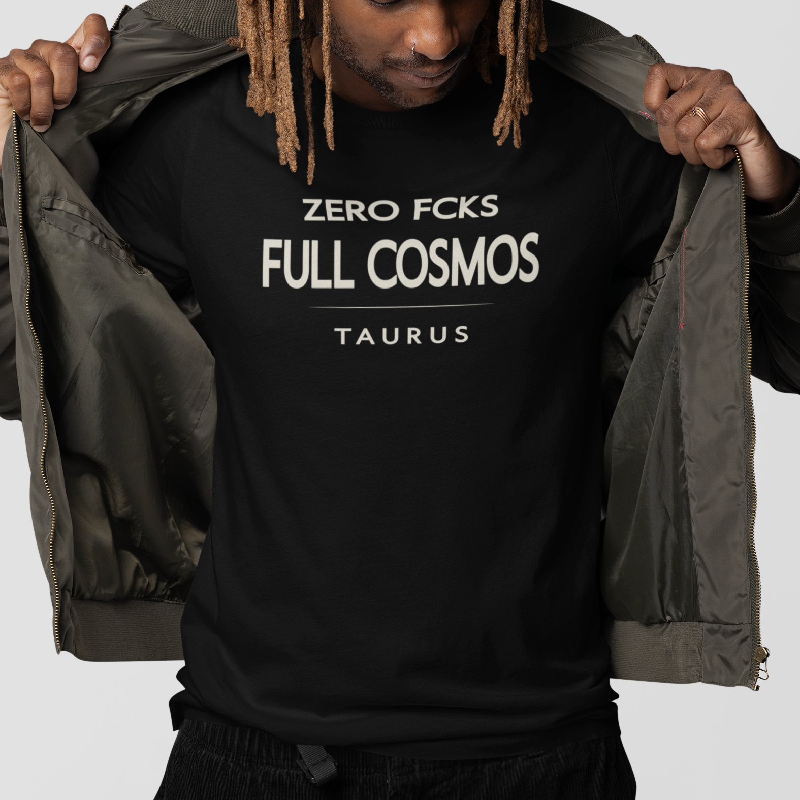 Model wearing Taurus zodiac t-shirt with “Zero Fcks Full Cosmos” typography quote