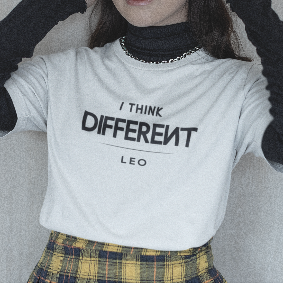 Model wearing Leo zodiac t-shirt with “I Think Different” typography quote design