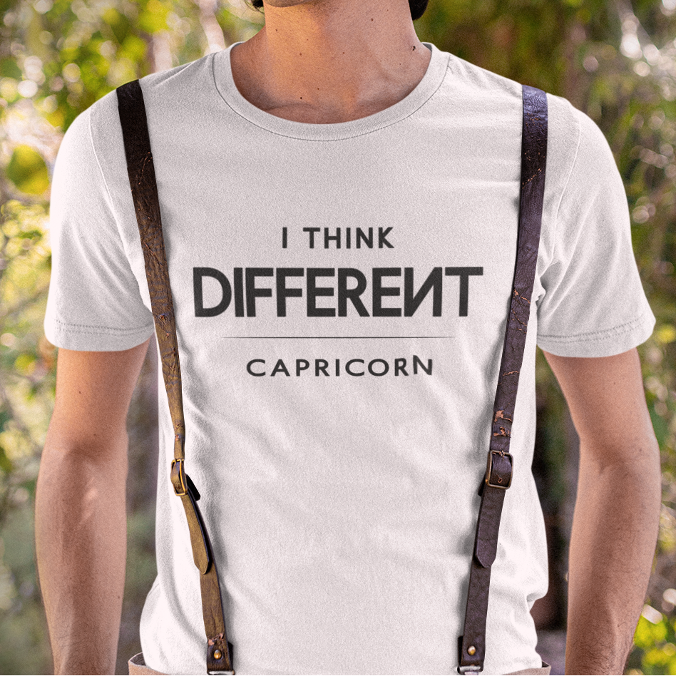 Model wearing Capricorn zodiac t-shirt with “I Think Different” typography quote design