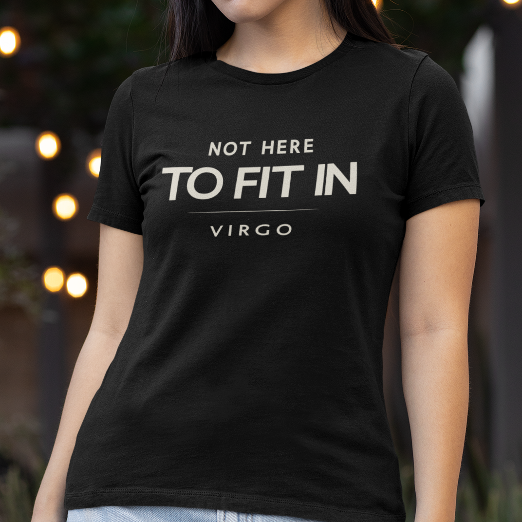 Model wearing Virgo zodiac t-shirt with “Not Here to Fit In” typography quote design
