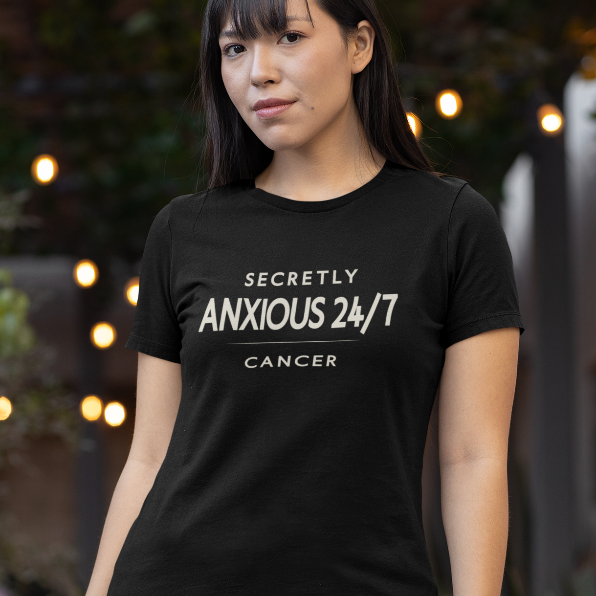 Model wearing Cancer zodiac t-shirt with “Secretly Anxious 24/7” typography quote design