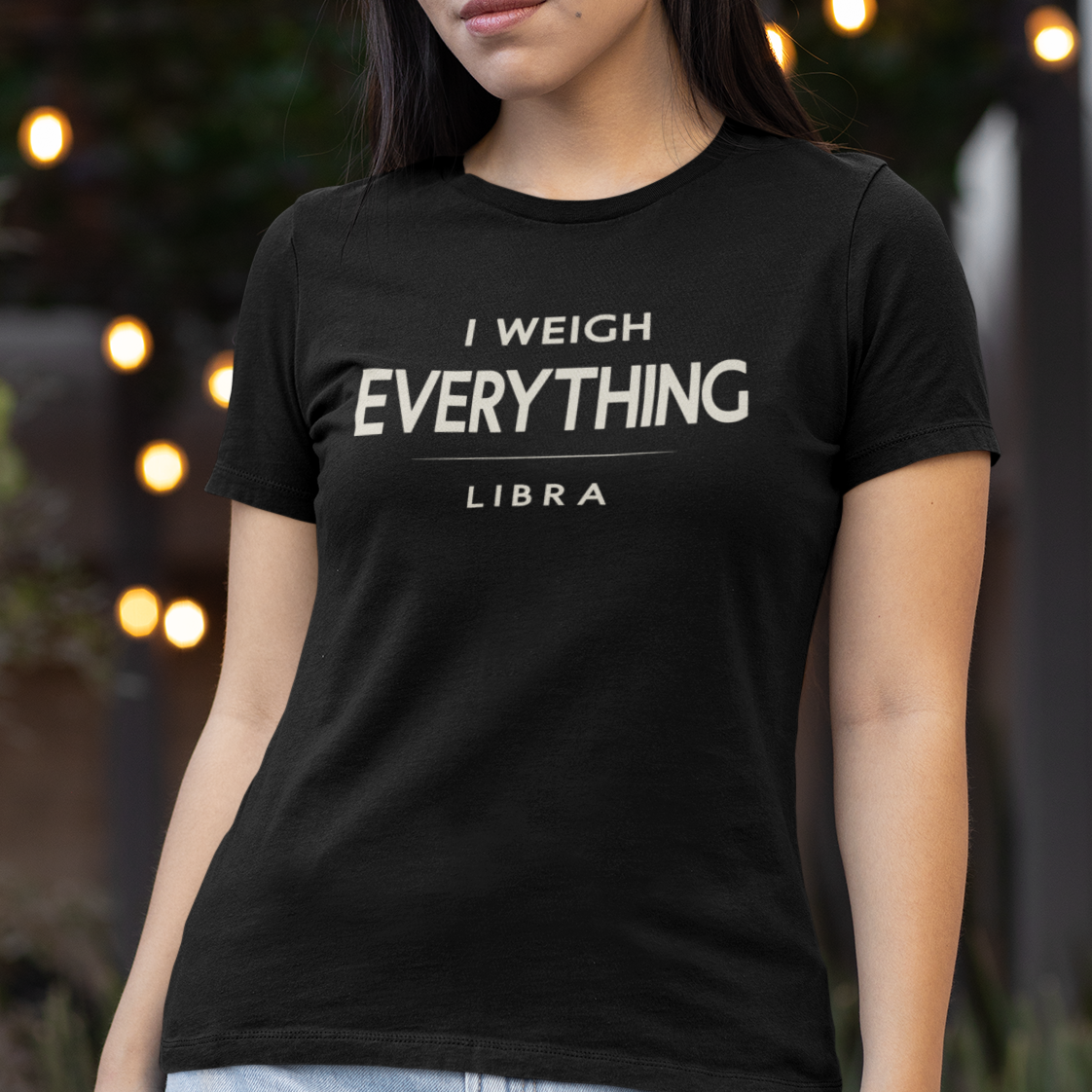 Model wearing Libra zodiac t-shirt with “I Weigh Everything” typography quote