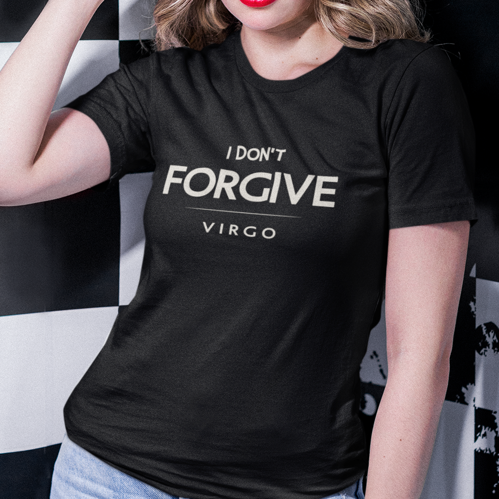 Model wearing black Virgo zodiac t-shirt with “I don’t forgive” bold typography, red sunglasses, and checkered background