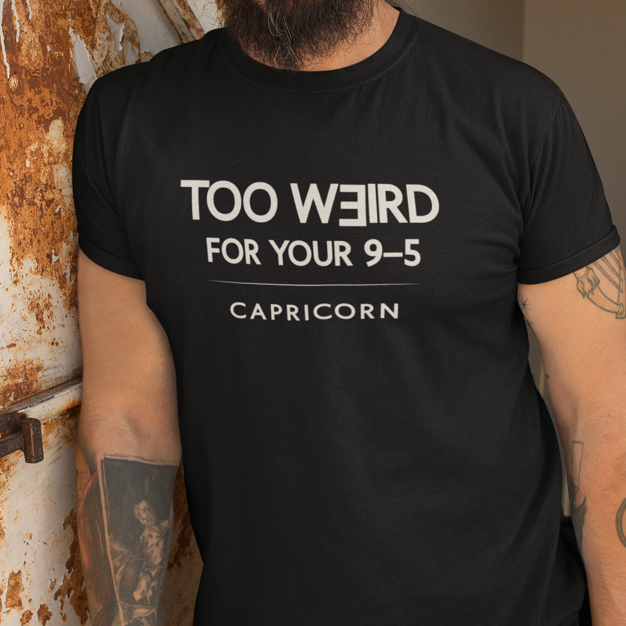 Model wearing Capricorn zodiac t-shirt with “Too Weird for Your 9–5” typography quote