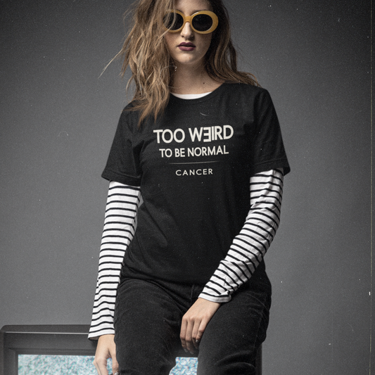 Model wearing Cancer zodiac t-shirt with “Too Weird to Be Normal” typography quote design