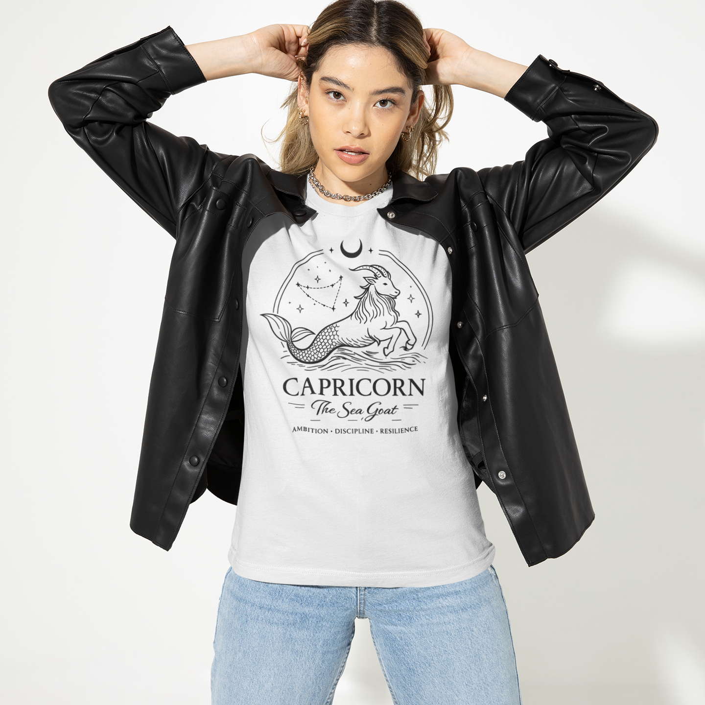 Model wearing a white Capricorn Sea Goat T-shirt with elegant astrology illustration