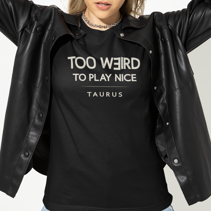 Model wearing Taurus zodiac t-shirt with “Too Weird to Play Nice” typography quote