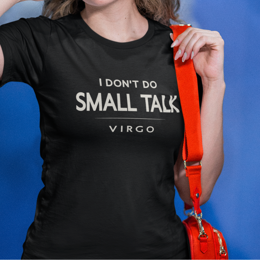 Model wearing black Virgo zodiac t-shirt “I don’t do small talk” with orange bag strap