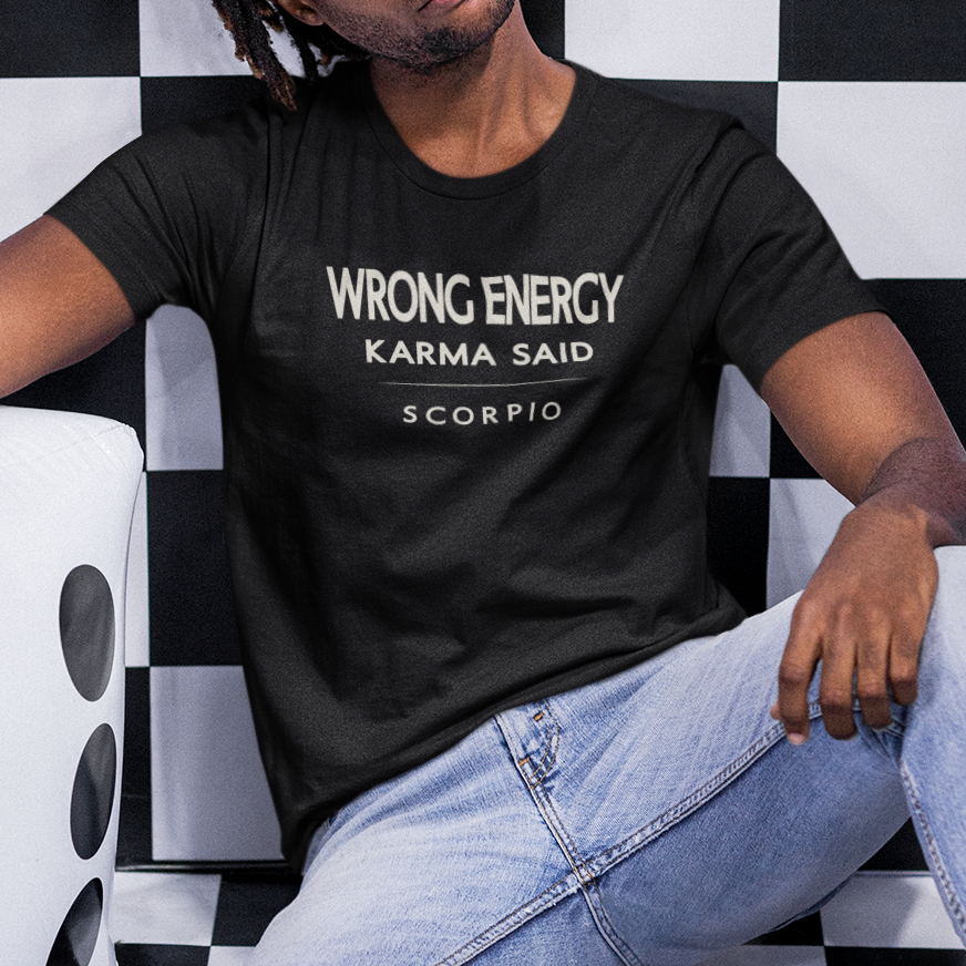 Model wearing Scorpio zodiac t-shirt with “Wrong Energy Karma Said” typography quote