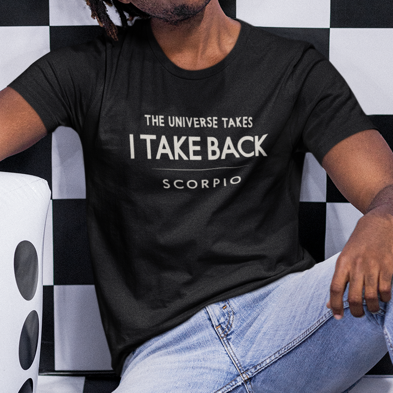 Model wearing Scorpio zodiac t-shirt with “The Universe Takes I Take Back” quote