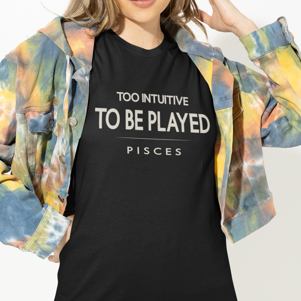 Model wearing Pisces zodiac t-shirt with “Too Intuitive to Be Played” typography quote