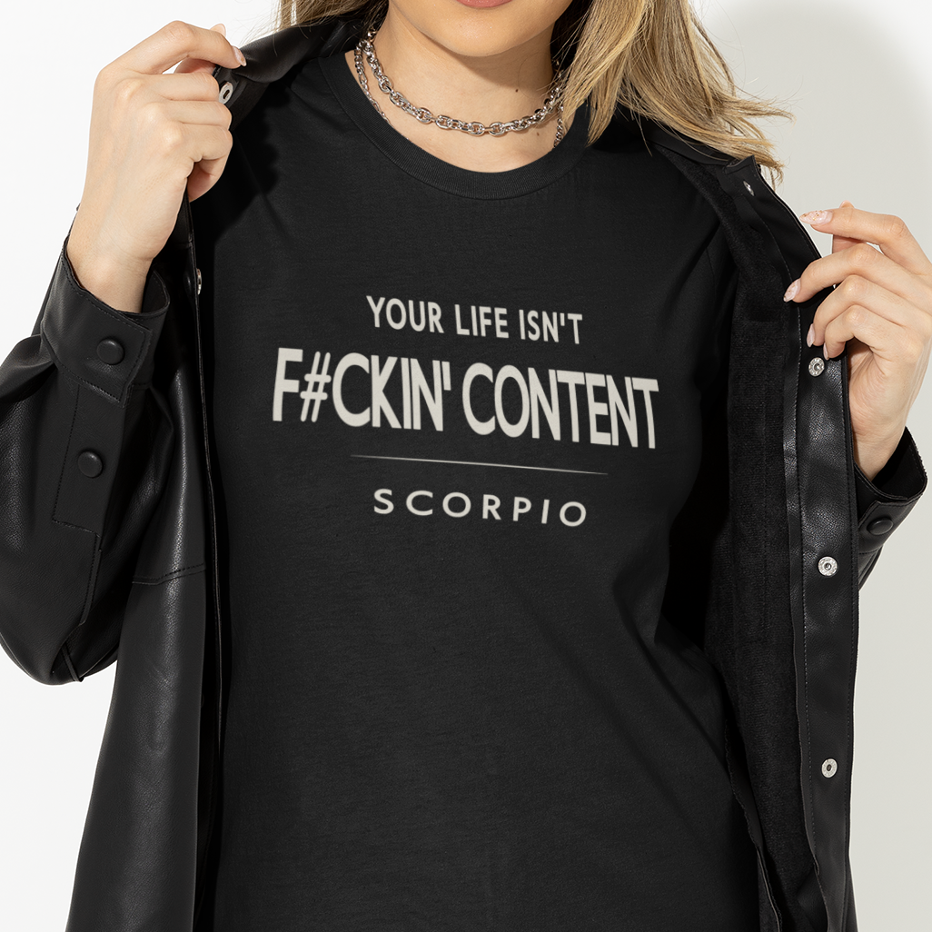 Model wearing Scorpio zodiac t-shirt with Your Life Isn’t F#ckin’ Content typography.
